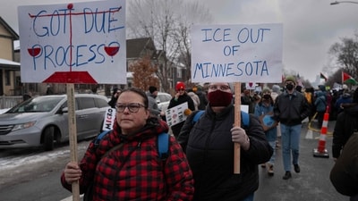 MINNEAPOLIS, MINNESOTA - JANUARY 10: Demonstrators march from Powderhorn Park past the site where Renee Good was killed on January 10, 2026 in Minneapolis, Minnesota. Good was fatally shot by an immigration enforcement agent during an incident in south Minneapolis on January 7.   Scott Olson/Getty Images/AFP (Photo by SCOTT OLSON / GETTY IMAGES NORTH AMERICA / Getty Images via AFP) (Getty Images via AFP)