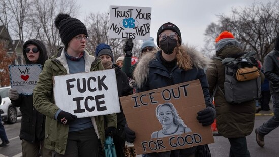 MINNEAPOLIS, MINNESOTA - JANUARY 10: EDITOR'S NOTE: Image contains profanity. Demonstrators march from Powderhorn Park past the site where Renee Good was killed on January 10, 2026 in Minneapolis, Minnesota. Good was fatally shot by an immigration enforcement agent during an incident in south Minneapolis on January 7. Scott Olson/Getty Images/AFP (Photo by SCOTT OLSON / GETTY IMAGES NORTH AMERICA / Getty Images via AFP)(Getty Images via AFP)