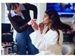 The BTS shots revealed a more relaxed pair: Priyanka Chopra touching up her makeup, Nick Jonas watching with a supportive grin, and a sweet moment where she kissed his cheek. (Instagram/ Priyanka Chopra)