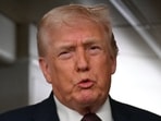 US President Donald Trump speaks to the press aboard Air Force One on January 11, 2026. 