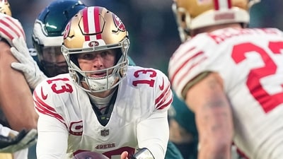 Brock Purdy of the San Francisco 49ers hands the ball off to Christian McCaffrey of the San Francisco 49ers vs Eagles. (Getty Images via AFP) Brock Purdy of the San Francisco 49ers hands the ball off to Christian McCaffrey of the San Francisco 49ers vs Eagles. (Getty Images via AFP)