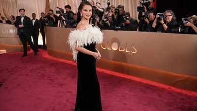 Selena Gomez had a standout night at the 83rd Golden Globe Awards, marking her first major red-carpet appearance since her marriage to Benny Blanco in late 2025. She wore a sophisticated black velvet bustier column dress by Chanel. The focal point was a dramatic, off-the-shoulder neckline adorned with sculptural white flowers handcrafted from feathers, silk chiffon, and silk organza. (AP) Selena Gomez had a standout night at the 83rd Golden Globe Awards, marking her first major red-carpet appearance since her marriage to Benny Blanco in late 2025. She wore a sophisticated black velvet bustier column dress by Chanel. The focal point was a dramatic, off-the-shoulder neckline adorned with sculptural white flowers handcrafted from feathers, silk chiffon, and silk organza. (AP)