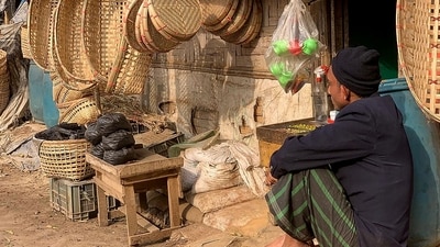 A Rohingya refugee sits outside a shop selling bamboo items at the Kutupalong refugee camp in Ukhia. (AFP) A Rohingya refugee sits outside a shop selling bamboo items at the Kutupalong refugee camp in Ukhia. (AFP)