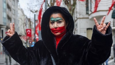 An Iranian woman living in Turkey gestures during a demonstration in support of nationwide protests in Iran, near the Iranian consulate in Istanbul, Turkey, January 11, 2026. (REUTERS)