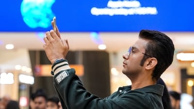 A customer checks an iPhone in Noida. The AI deal announced on Monday marks a major vote of confidence for Google. Its technology already drives much of Samsung's 'Galaxy AI', but the Siri deal unlocks a large market with Apple's installed base of more than 2 billion active devices. (PTI) A customer checks an iPhone in Noida. The AI deal announced on Monday marks a major vote of confidence for Google. Its technology already drives much of Samsung's 'Galaxy AI', but the Siri deal unlocks a large market with Apple's installed base of more than 2 billion active devices. (PTI)