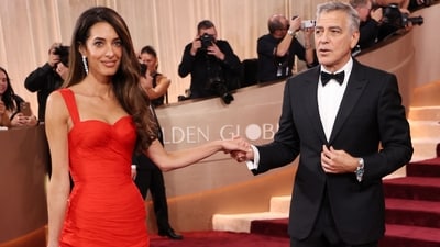 George Clooney and his wife Amal Clooney attend the 83rd annual Golden Globe Awards at the Beverly Hilton hotel in Beverly Hills, California, on January 11, 2026. (Photo by Michael Tran / AFP) / -- IMAGE RESTRICTED TO EDITORIAL USE - STRICTLY NO COMMERCIAL USE -- (AFP) George Clooney and his wife Amal Clooney attend the 83rd annual Golden Globe Awards at the Beverly Hilton hotel in Beverly Hills, California, on January 11, 2026. (Photo by Michael Tran / AFP) / -- IMAGE RESTRICTED TO EDITORIAL USE - STRICTLY NO COMMERCIAL USE -- (AFP)