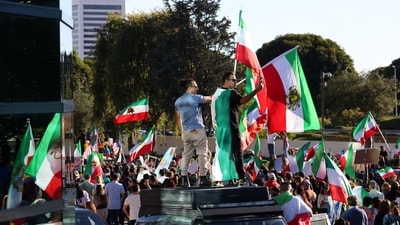 People take part in a "Free Iran" rally in Los Angeles, California, on January 11, 2026. The protests, initially sparked by anger over the rising cost of living, have evolved into a movement against the theocratic system in place in Iran since the 1979 revolution. (AFP) People take part in a "Free Iran" rally in Los Angeles, California, on January 11, 2026. The protests, initially sparked by anger over the rising cost of living, have evolved into a movement against the theocratic system in place in Iran since the 1979 revolution. (AFP)