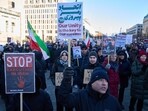 Protesters participate in a demonstration in front of the Brandenburg Gate in Berlin, Germany, in support of the nationwide mass protests in Iran against the government, Sunday, Jan. 11, 2026.