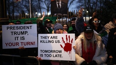 Anti-Iranian regime protesters wave Iranian flags during a gathering outside the Iranian Embassy, central London, on January 12, 2026. (AFP) Anti-Iranian regime protesters wave Iranian flags during a gathering outside the Iranian Embassy, central London, on January 12, 2026. (AFP)