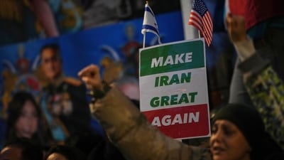 Protesters hold up placards and flags as they demonstrate outside the Iranian Embassy in London, Monday, Jan. 12, 2026. (AP) Protesters hold up placards and flags as they demonstrate outside the Iranian Embassy in London, Monday, Jan. 12, 2026. (AP)