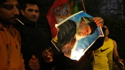 A picture of Ayatollah Ali Khamenei is set alight by protesters outside the Iranian Embassy in London, Monday, Jan. 12, 2026. (AP) A picture of Ayatollah Ali Khamenei is set alight by protesters outside the Iranian Embassy in London, Monday, Jan. 12, 2026. (AP)