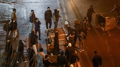 Iranian demonstrators gather in a street during a protest over the collapse of the currency's value, in Tehran, Iran, January 8, 2026. (via REUTERS)