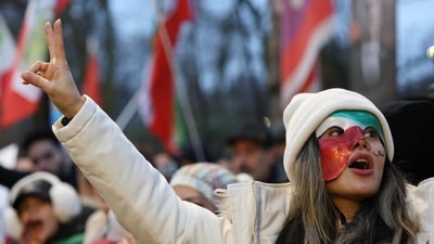 A demonstrator gestures outside the Iranian embassy during a rally in support of nationwide protests in Iran, in London, Britain, January 12, 2026. (REUTERS)