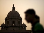 A commuter walks past the building of India's Ministry of Finance during dusk in New Delhi (REUTERS FILE)