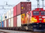 A freight train carrying cargo containers rides along a railway track in Ajmer on August 26 (AFP FILE)