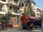 A tanker agency supplying water in Sector 46, said that the prices were increased due to unavailability of water across the city. (Parveen Kumar/Hindustan Times)