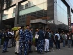 Security force personnel stand guard in front of I-PAC office while Enforcement Directorate (ED) conducts the raid at Infinity Waterside building, Sector V, Salt Lake in Kolkata. (Photo by Samir Jana/ Hindustan Times)