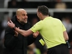 Manchester City manager Pep Guardiola remonstrates with referee Chris Kavanagh.
