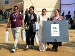 Polling officials carrying EVMs and other election material leave for their respective polling booths, a day before Maharashtra municipal corporation elections, in Nagpur