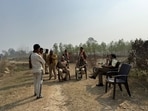 Forest department officials planning their next move after a tiger sighting was confirmed in Bahraich district on Thursday (HT Photo) Forest department officials planning their next move after a tiger sighting was confirmed in Bahraich district on Thursday (HT Photo)