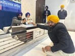 Punjab CM Bhagwant Mann meets Akal Takht acting jathedar Giani Kuldeep Singh Gargaj and Takht Damdama Sahib jathedar Baba Tek Singh Dhanaula at Akal Takht secretariat in Amritsar on Thursday. (HT Photo)