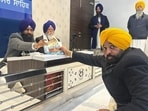 Punjab chief minister Bhagwant Mann appearing before acting jathedar Giani Kuldeep Singh Gargaj and Takht Damdama Sahib jathedar Baba Tek Singh Dhanaula at the Akal Takht secretariat in Amritsar on Thursday. (HT Photo)