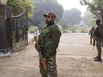 Security personnel maintain vigil outside the convention centre during the second-day security review meeting chaired by Union home secretary Govind Mohan, in Jammu, on Thursday. (PTI)