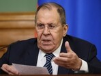 Russian Foreign Minister Sergey Lavrov gestures during a news conference 