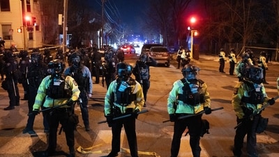Minnesota State Troopers pushed back a crowd as federal officers clashed with residents following a shooting in Minneapolis, Minnesota, early Thursday, January 15, 2026. Photographer: Victor J. Blue/Bloomberg (Bloomberg)