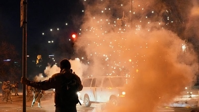 An individual remains amid drifting tear gas after police used crowd-control agents and munitions on protestors. REUTERS/Leah Millis (REUTERS)