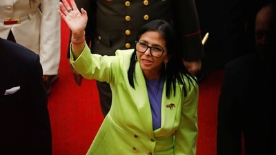 Venezuela's interim president Delcy Rodriguez waves as she walks to deliver her first annual address to the nation at the National Assembly. (Reuters)