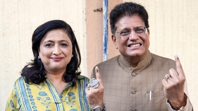 Union Minister Piyush Goyal with his wife shows their inked finger after casting vote for Municipal Corporation Elections, in Mumbai on Thursday (Deepak Salvi) Union Minister Piyush Goyal with his wife shows their inked finger after casting vote for Municipal Corporation Elections, in Mumbai on Thursday (Deepak Salvi)