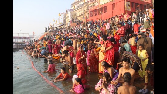Thousands of devotees take a holy dip in the Ganges at the ghats of Varanasi on Thursday (Rajesh Singh/HT)
