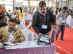 Polling officials during counting of votes in Maharashtra on Friday.
