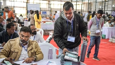 Polling officials during counting of votes in Maharashtra on Friday. (PTI) Polling officials during counting of votes in Maharashtra on Friday. (PTI)