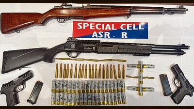The Amritsar rural police have busted a well-organised narcotics smuggling gang and arrested three accused, recovering 5 kg heroin along with sophisticated weapons and ammunition, said Sandeep Goyal, DIG (border range), on Friday. (HT Photo) The Amritsar rural police have busted a well-organised narcotics smuggling gang and arrested three accused, recovering 5 kg heroin along with sophisticated weapons and ammunition, said Sandeep Goyal, DIG (border range), on Friday. (HT Photo)