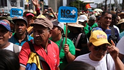 Demonstrators march to demand the release of ousted President Nicolas Maduro and his wife Cilia Flores, following their capture by US in Caracas. (Reuters)