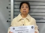 Lijie Cui has her mugshot captured on January 13, 2026, following her detention for unspecified immigration violations in Saipan.