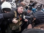 Jake Lang walks away from counter-protesters during his "March Against Minnesota Fraud" 
