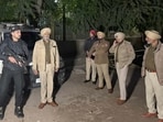Police outside a court in Ludhiana where gangster Kaushal Chaudhary was brought on a stretcher after fracturing both legs in failed escape bid on Saturday. (HT Photo)