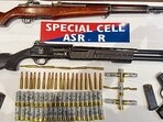 The Amritsar rural police have busted a well-organised narcotics smuggling gang and arrested three accused, recovering 5 kg heroin along with sophisticated weapons and ammunition, said Sandeep Goyal, DIG (border range), on Friday. (HT Photo)