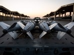 US Airmen prepare to load GBU-31 munition systems onto F-15E Strike Eagles, in support of Operation Hawkeye Strike.