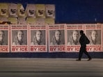 A man walks by a series of posters memorializing Renee Good on January 16, 2026 in Minneapolis, Minnesota. 
