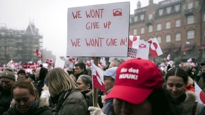 Waving the flags of Denmark and Greenland, the protesters formed a sea of red and white outside Copenhagen city hall, chanting "Kalaallit Nunaat!" -- the vast Arctic island's name in Greenlandic. (Bloomberg) Waving the flags of Denmark and Greenland, the protesters formed a sea of red and white outside Copenhagen city hall, chanting "Kalaallit Nunaat!" -- the vast Arctic island's name in Greenlandic. (Bloomberg)