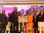 Chief minister Yogi Adityanath and deputy CM Brajesh Pathak at the UP HealthTech Conclave 1.0’ in Lucknow on Sunday. (HT)