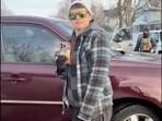 This image from video made by Immigration and Customs Enforcement officer Jonathan Ross via Alpha News shows Becca Good, wife of Renee Good, standing outside their vehicle in Minneapolis on Jan 7, 2026.