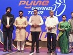 Maharashtra chief minister Devendra Fadnavis (C) attends the felicitation ceremony for athletes participating in the International Cycling Pune Grand Tour, in Pune, Saturday. (PTI)