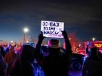 A protester holds up a sign during an anti-US Immigration and Customs Enforcement (ICE) protest in front of the Bishop Henry Whipple Federal Building in Minneapolis, Minnesota.