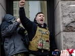 MINNEAPOLIS, MINNESOTA - JANUARY 17: Right wing influencer Jake Lang is confronted by protesters at a rally near city hall on January 17, 2026 in Minneapolis, Minnesota. (Photo by Jim Vondruska / GETTY IMAGES NORTH AMERICA / Getty Images via AFP)