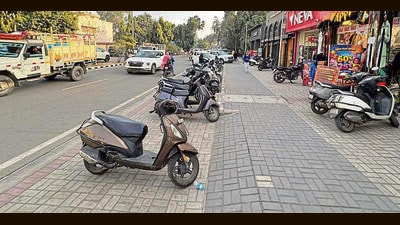 A footpath along Malhar Road slated for conversion into a dedicated cycle track under the project. (Manish/HT) A footpath along Malhar Road slated for conversion into a dedicated cycle track under the project. (Manish/HT)
